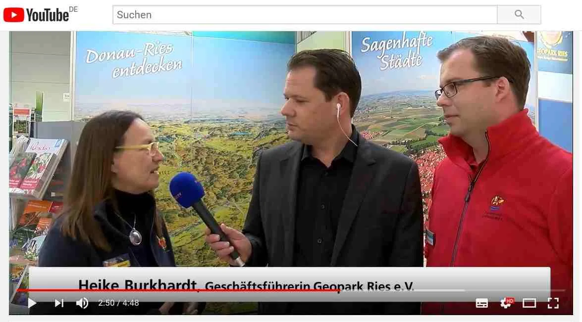 Der Screenshot eines YouTube-Videos zeigt Heike Burkhardt im Interview.